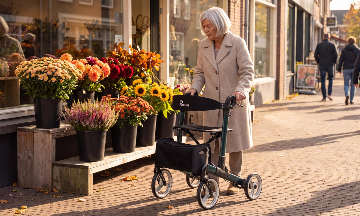 Parvum Luxo in petrol green by a flower shop; a woman stops at the buckets of autumn flowers.