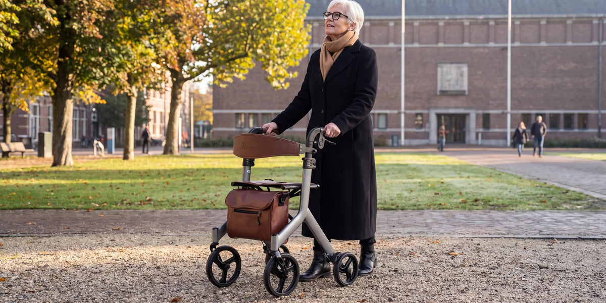 Parvum Vesta in silver on a square with autumn trees in the morning sun; a woman looks up at the trees.